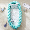 Babybett mit geflochtenem Rand - weiches Kuschelnest für Neugeborene