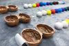 NUTSHELLIA – Casa de muñecas artesanal hecha con cáscaras de nuez y luz interior