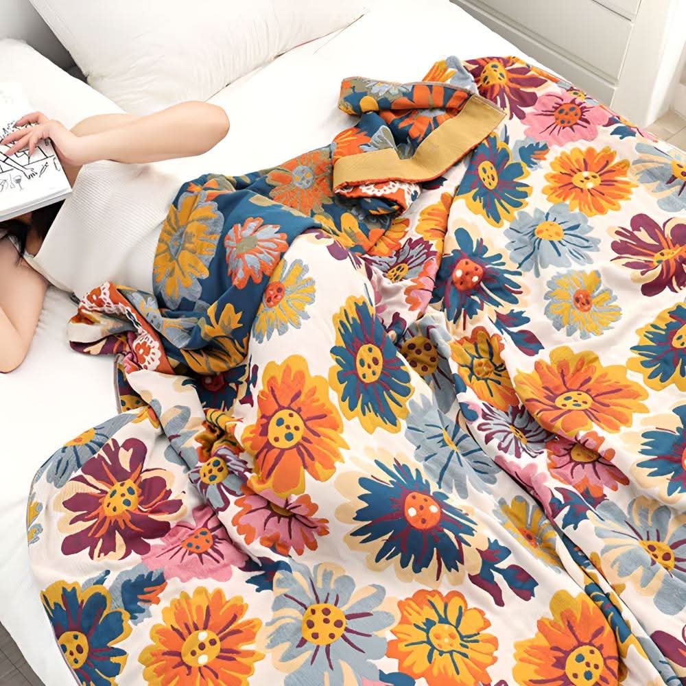 Bright floral cotton blanket on sofa